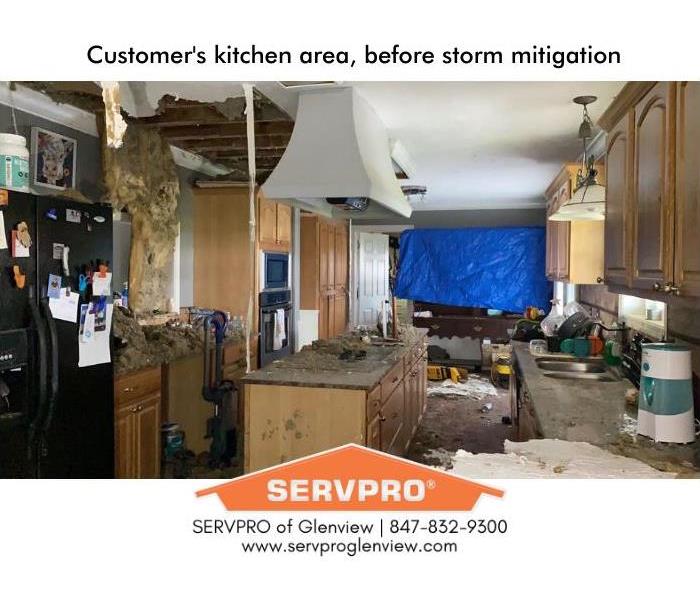 Kitchen with hurricane storm damage: collapsed ceilings, insulation all over counters
